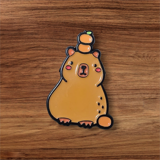 Capibara con naranjas